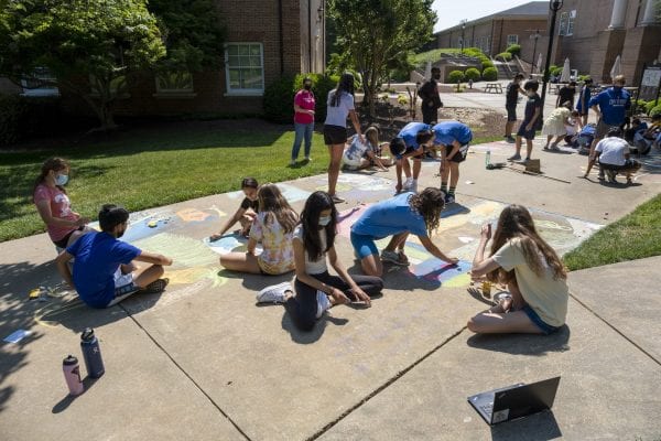 7th graders make chalk murals about empires and revolutions